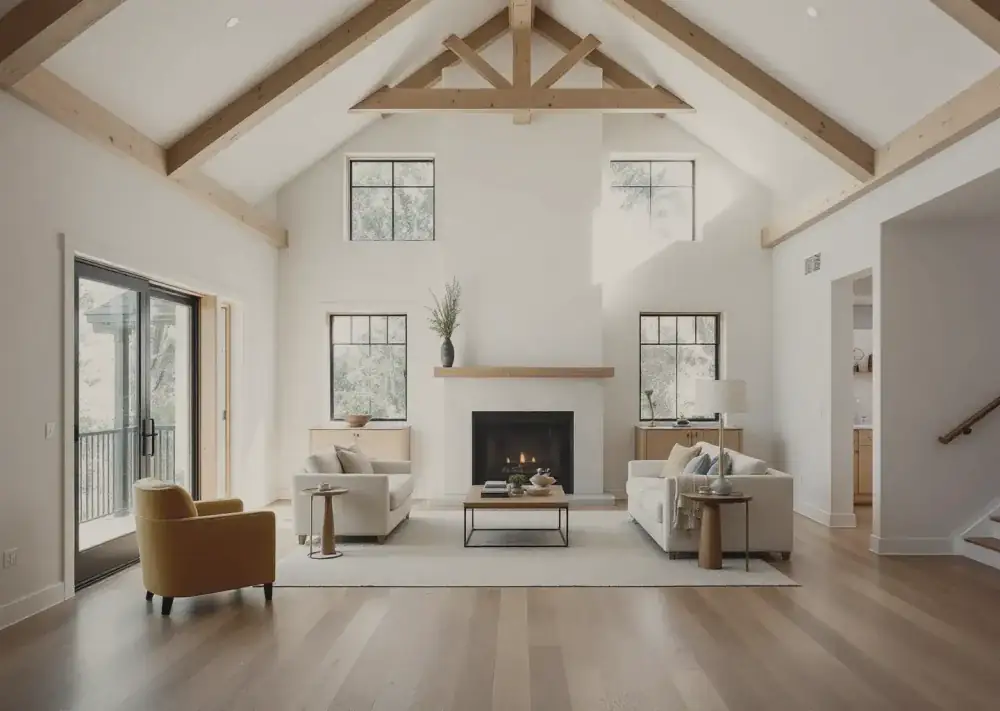 Double-height living room with exposed fir trusses, white oak floor and limestone hearth