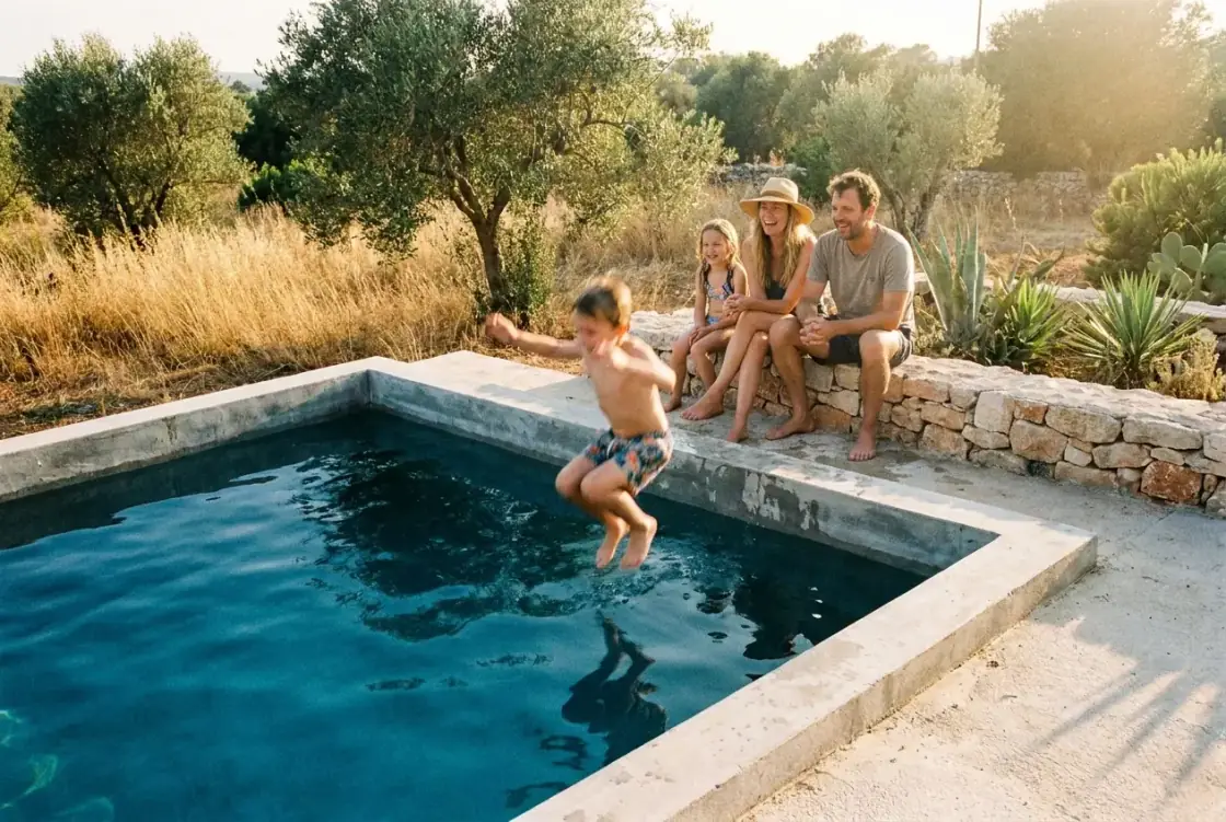 A family and children playing in a backyard swimming pool on a bright summer day